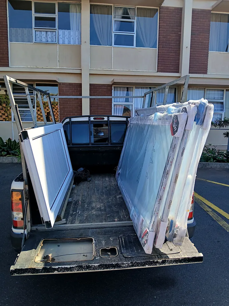 Bakkie loaded with new aluminium frames, ready for installation