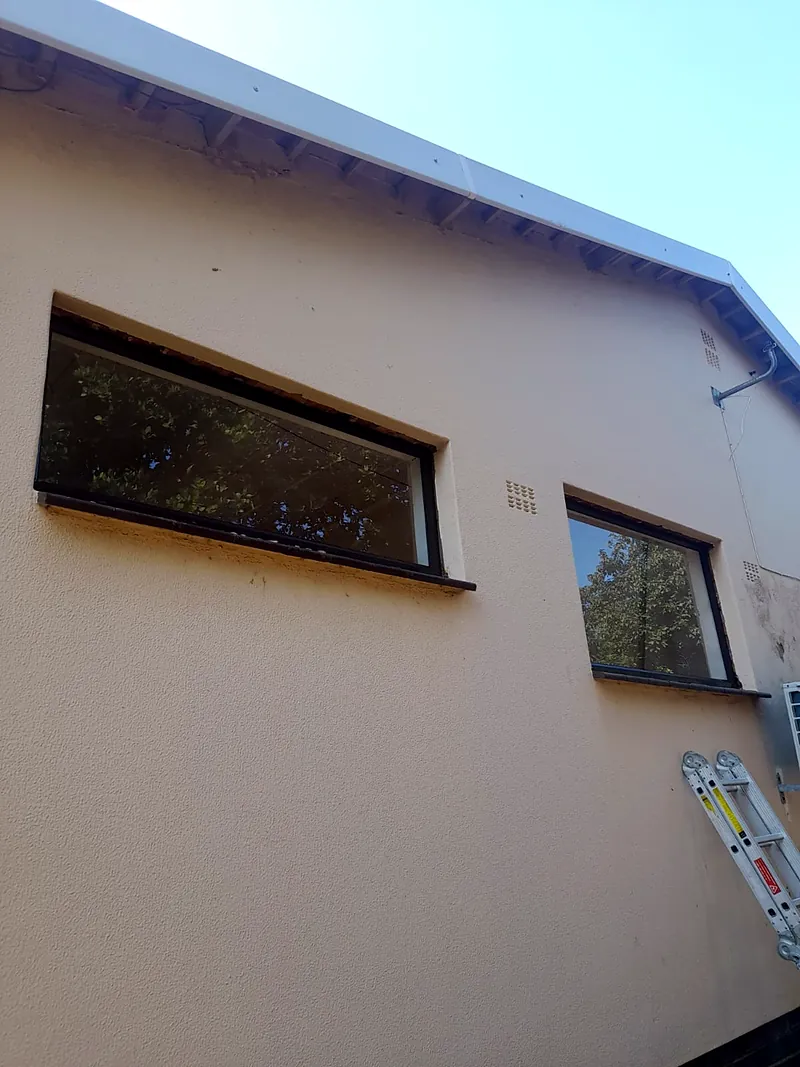 Completed bronze top-hung windows on a commercial building
